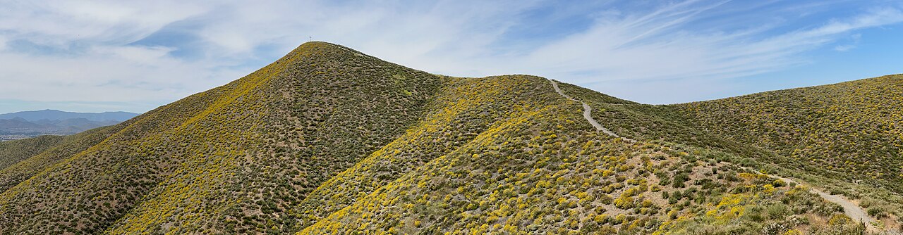 Chaparral-covered Menifee Hills beneath a blue sky